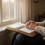 Eternal life: What the Bible means and how to receive it Person reflecting beside an open Bible in soft morning light